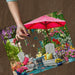 Jigsaw puzzle box with a garden scene featuring chairs, table, and umbrella, branded 'Springbok'.