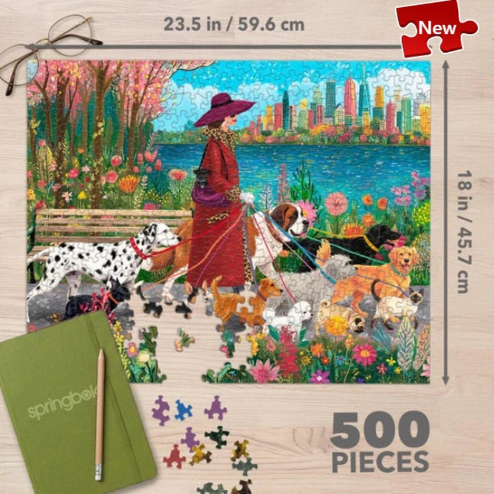 Springbok Fashionista Dog Walker 500-piece jigsaw puzzle featuring a stylish dog walker with dogs