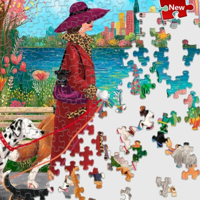 Springbok Fashionista Dog Walker 500-piece jigsaw puzzle featuring a stylish dog walker with dogs