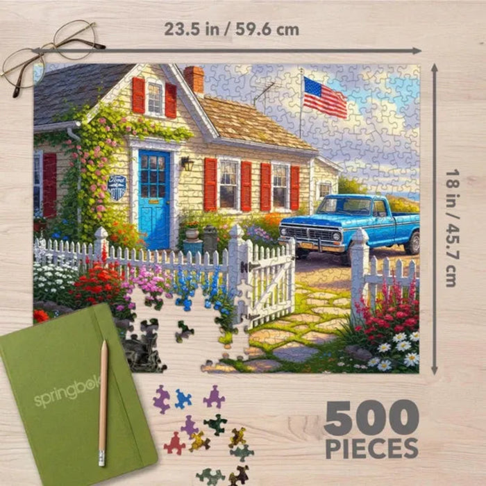 This Springbok Ford Home in Michigan 500-Piece Jigsaw Puzzle captures a charming automotive-inspired scene with nostalgic American character.