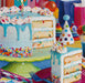 Colorful birthday cake puzzle with birthday hats and balloons