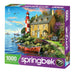 Springbok 1000-piece puzzle box with a scenic design of a lighthouse and house by the water.