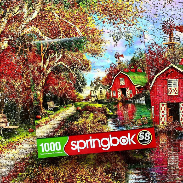 Jigsaw puzzle with a scenic design featuring a red barn and windmill, and Springbok branding.