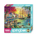 Springbok 1000-piece puzzle box with a scenic design of a coastal town and sailboat.