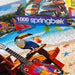 Springbok 1000-piece puzzle with a colorful box on a partially completed puzzle.