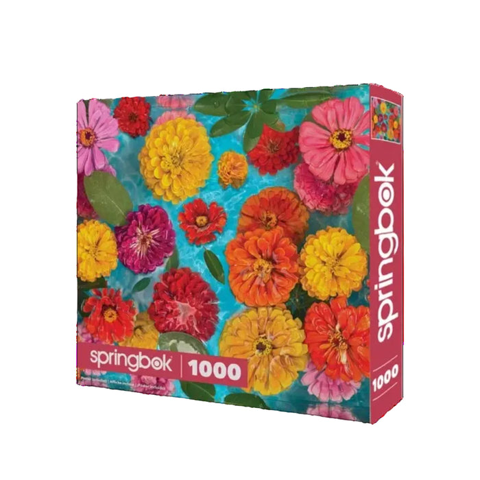 The Springbok Floating Flowers 1000 Piece Jigsaw Puzzle features vibrant, delicate flowers drifting across a serene background.