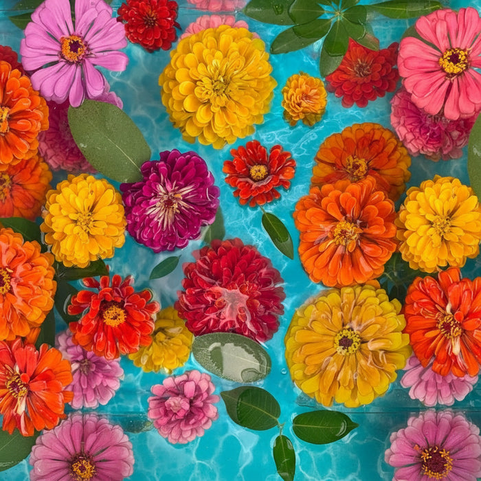 The Springbok Floating Flowers 1000 Piece Jigsaw Puzzle features vibrant, delicate flowers drifting across a serene background.