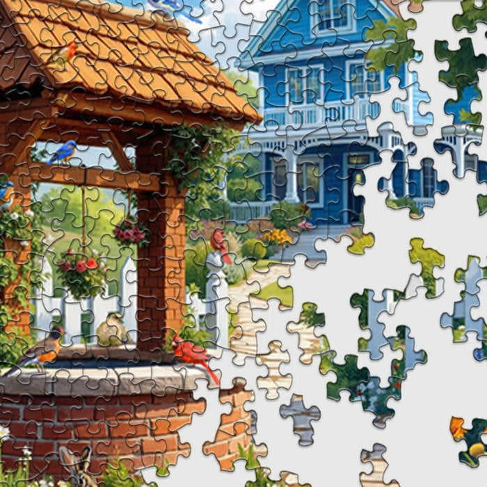 Jigsaw puzzle with a completed section showing a house and well, with missing pieces around.