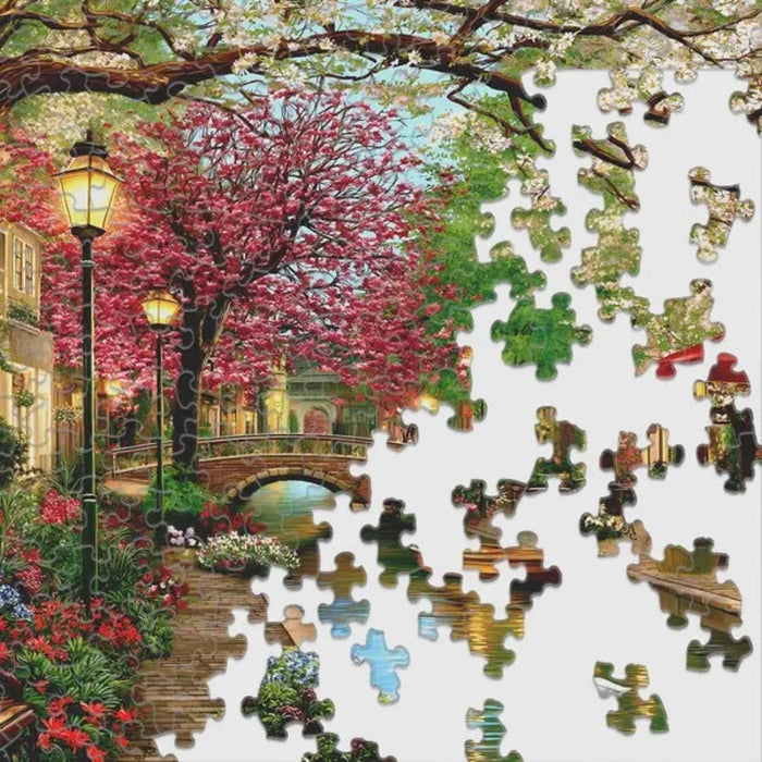 Springbok Golden Hour Canal 1000-piece jigsaw puzzle featuring a scenic canal glowing in warm golden light
