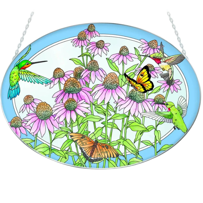 This Bridgeton Hall Hummingbirds and Coneflowers Medium Oval Suncatcher showcases the beauty of hummingbirds and blooming coneflowers in an elegant oval design.
