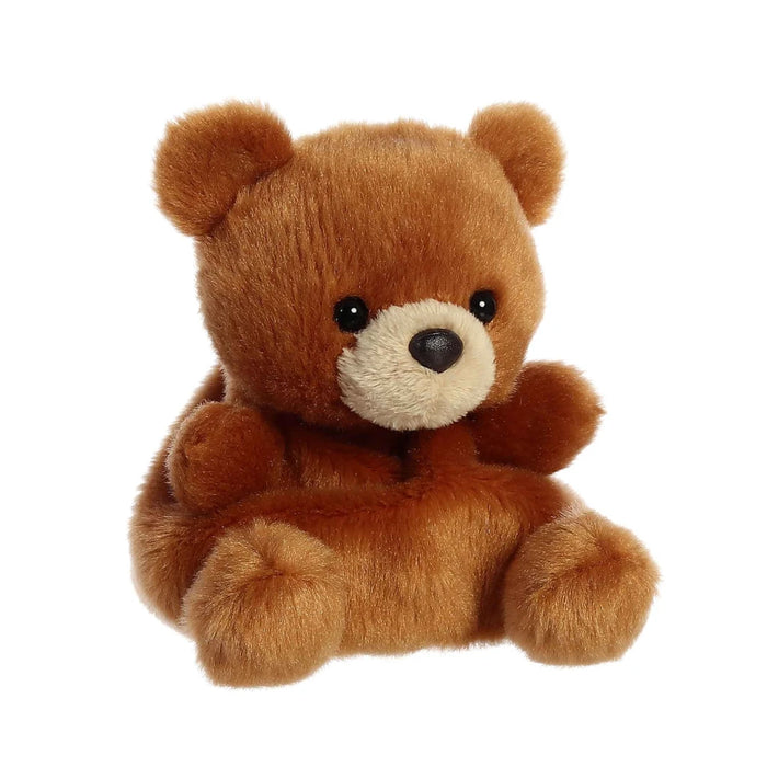 A plush brown teddy bear positioned on a white backdrop.