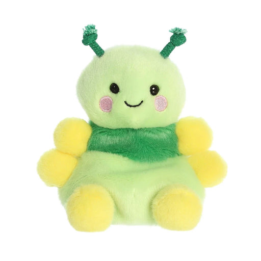 A green and yellow stuffed animal adorned with a pink bow, showcasing a playful and cheerful design.