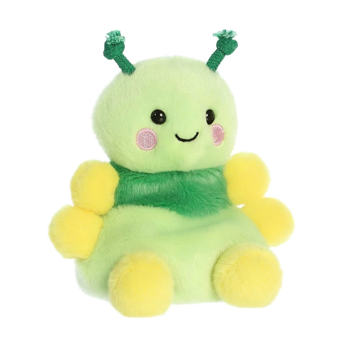 A plush toy featuring green and yellow colors, complemented by a charming pink bow, perfect for children.