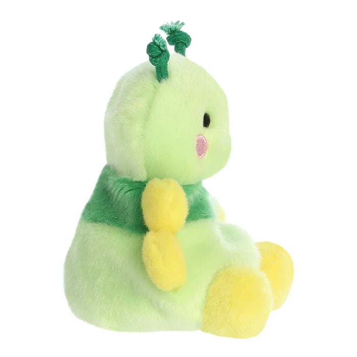A vibrant stuffed animal in green and yellow, highlighted by a cute pink bow, ideal for cuddling and play.