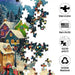 This Springbok Festive Christmas Village 500 Piece Jigsaw Puzzle captures a snow-dusted village alive with festive lights and holiday cheer.