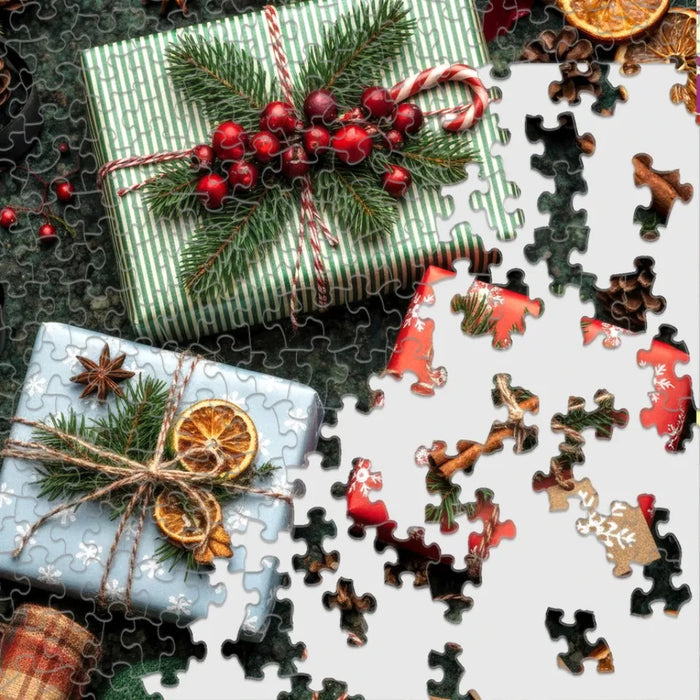 The Springbok Christmas Wrapping 500 Piece Jigsaw Puzzle features vibrant, festive artwork bursting with ribbons, bows, and colorful gift wrap.