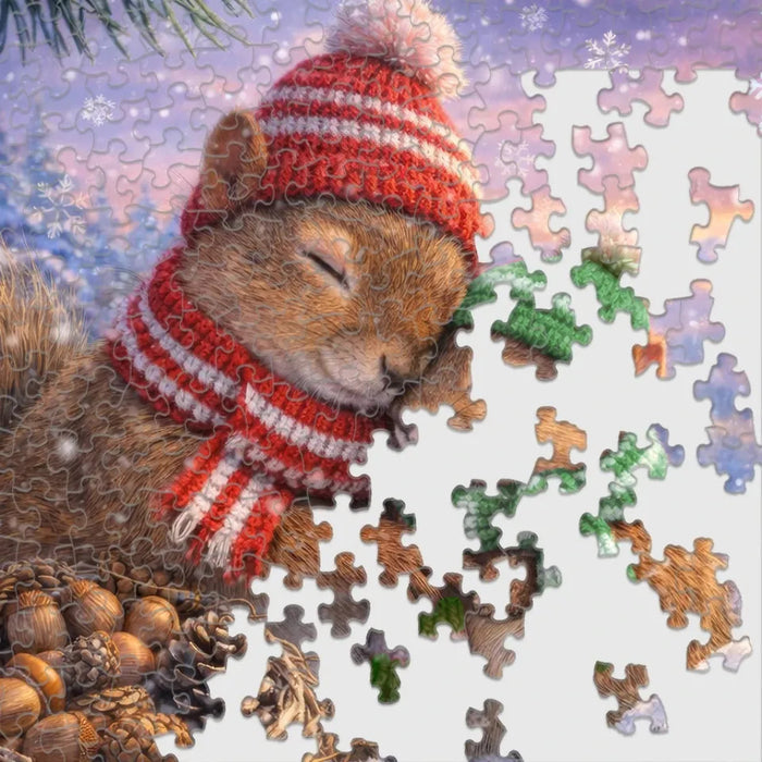 The Snowy Squirrels 500 Piece Jigsaw Puzzle features playful squirrels frolicking in a crisp, snow-covered landscape.