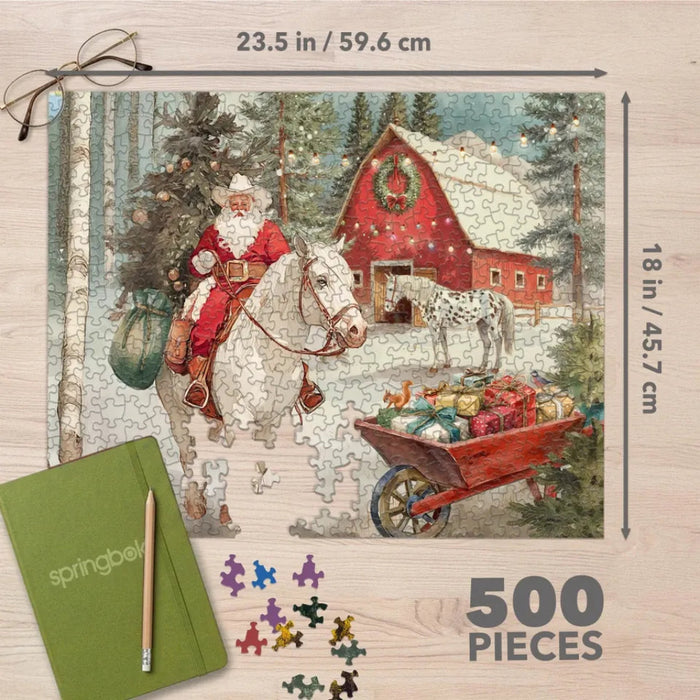 The Springbok Cowboy Santa 500 Piece Jigsaw Puzzle features a charming, festive cowboy Santa scene full of color and detail.
