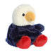 A stuffed bald eagle perched on a white background, featuring realistic details and a soft texture.