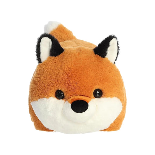 A plush fox toy resting on its side, showcasing its soft fur and playful expression.