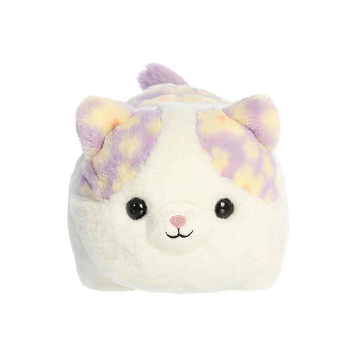 A soft stuffed animal resembling a white and purple cat, featuring large eyes and a playful expression.