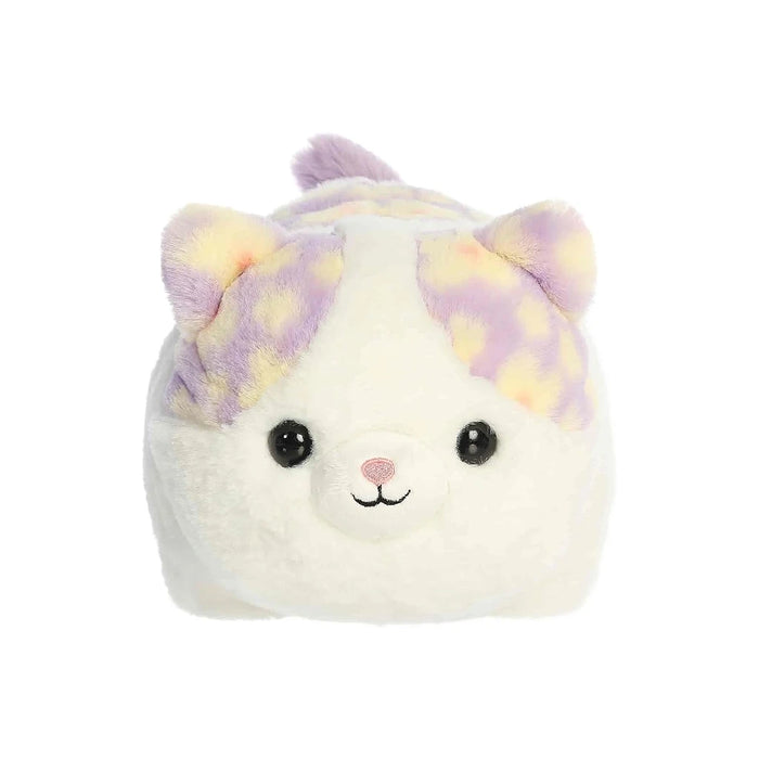 A soft stuffed animal resembling a white and purple cat, featuring large eyes and a playful expression.