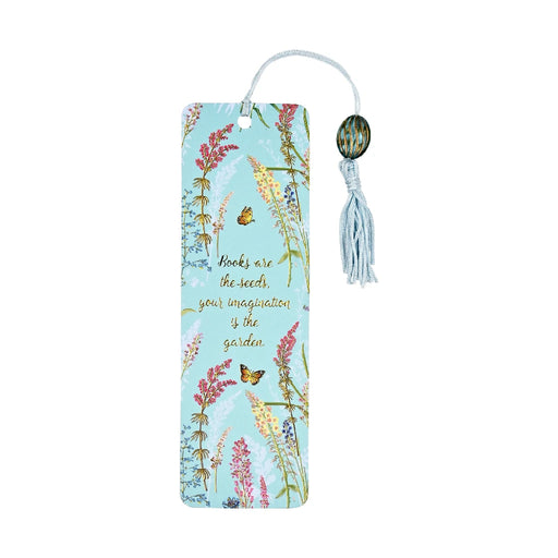 A colorful butterfly-shaped bookmark resting on an open book page, adding a whimsical touch to reading.