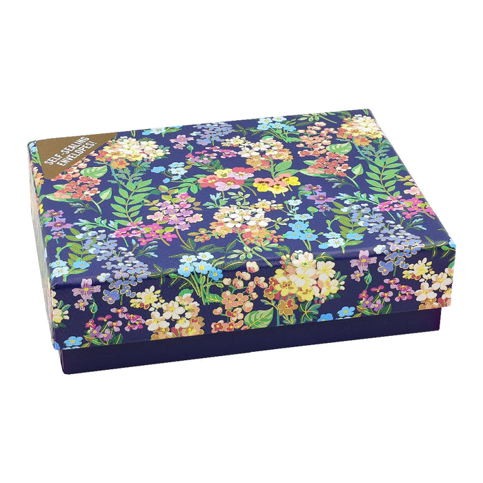 A blue box featuring a floral pattern, adding a touch of nature to its appearance.