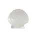 A white shell-shaped dish on a plain white background, emphasizing its elegant design and simplicity.