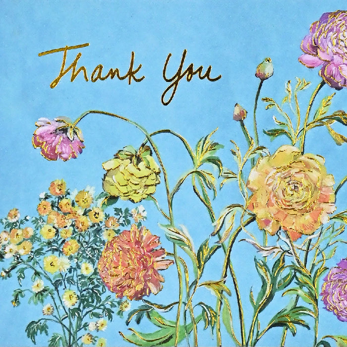 A thank you card adorned with vibrant flowers, conveying appreciation in a stylish format.
