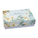 A thank you card and envelope adorned with colorful flowers, resting on a light surface.
