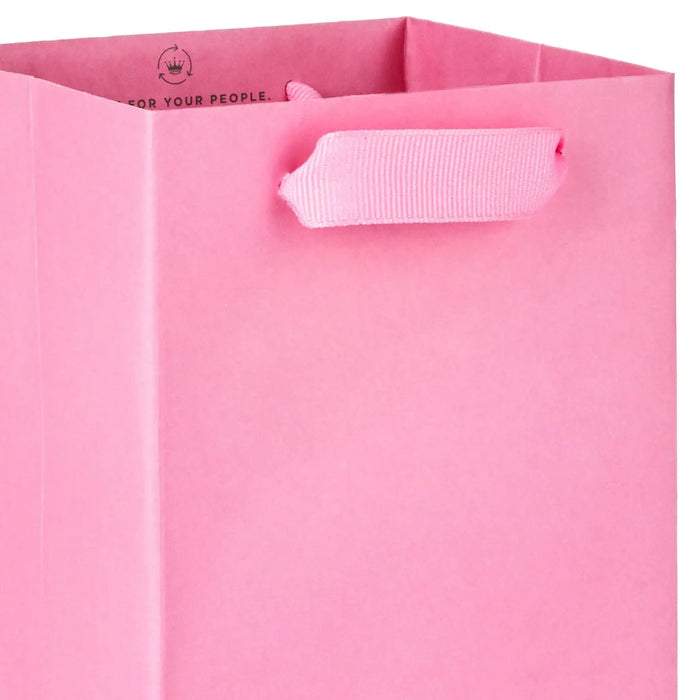Close‑up of pink matte wine gift bag