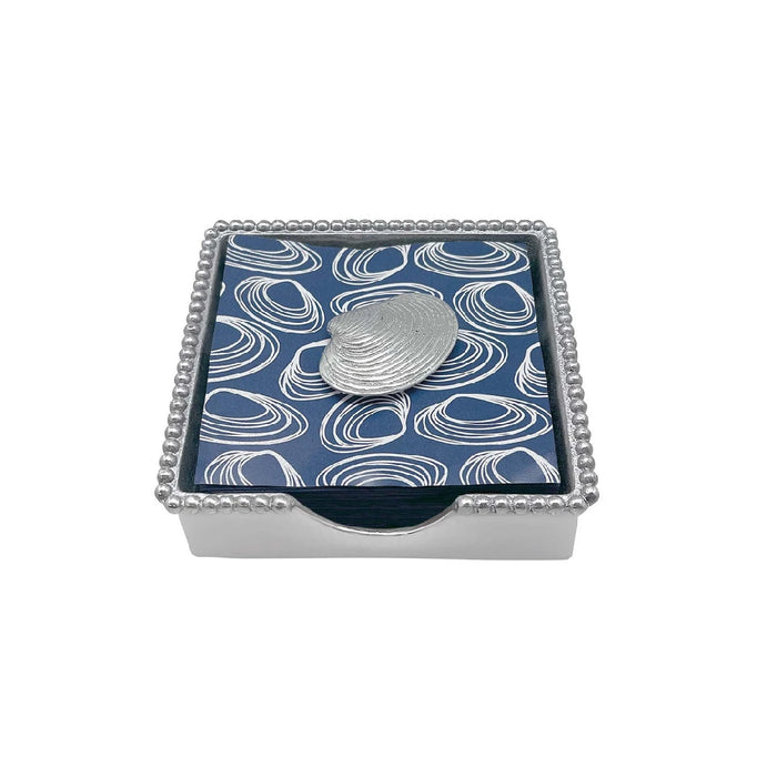 A square box with a shiny silver coin resting on top, highlighting its metallic surface and smooth edges.