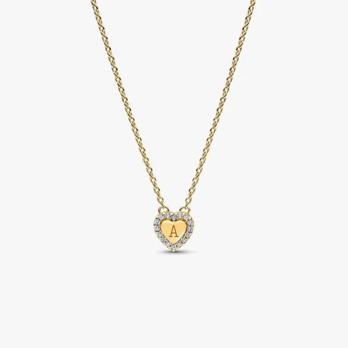 Close-up of the Pandora Engravable Heart Halo Collier Necklace in 14k gold plating, showing the heart pendant with cubic zirconia halo on a white background.
