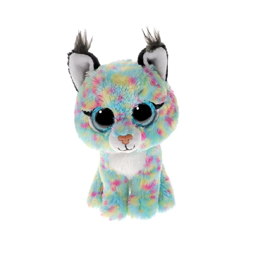 A colorful Ty Beanie Boo plush kitty cat with large eyes and a playful expression, sitting upright on a soft surface.
