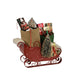 Decorative Byer's Choice  sleigh with Christmas-themed items on a white background