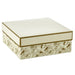 Large square gift box with gold‑foil floral design on a pink‑and‑cream base and solid white lid with metallic gold trim