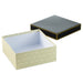 Open black‑and‑white gift box with gold accents