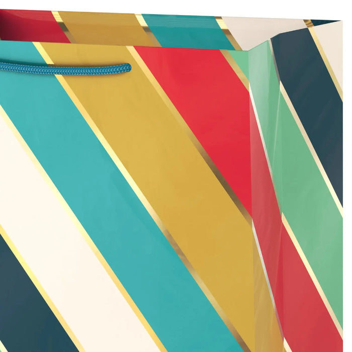 Close‑up of striped gift bag with gold accents