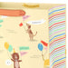Close‑up of yellow animal‑party gift bag