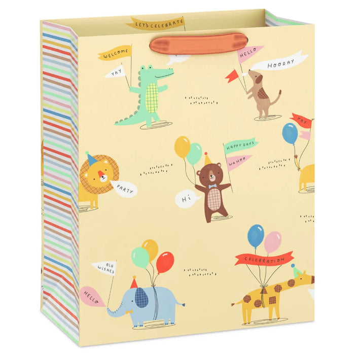 Large yellow gift bag featuring illustrated animals in party hats with balloons and celebration banners