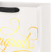 Close‑up of cream and gold “Congrats” gift bag