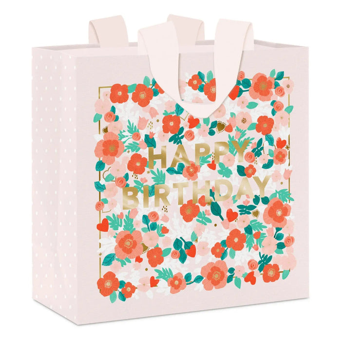 Medium floral birthday gift bag on a white background