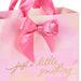 Close‑up of pink and peach gift bag with gold‑foil script