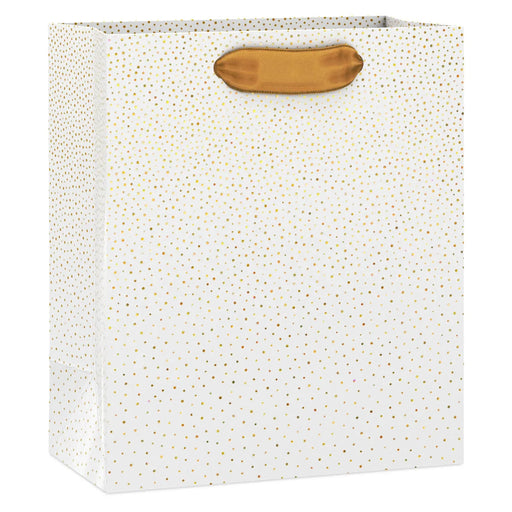 Small cream gift bag with scattered gold foil dots and satin ribbon handles