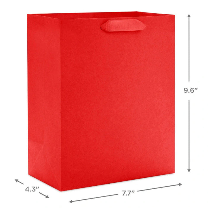 Hallmark 9.6-inch solid red medium gift bag with a classic matte finish, sturdy handles, and a versatile design for birthdays, holidays, and special occasions.