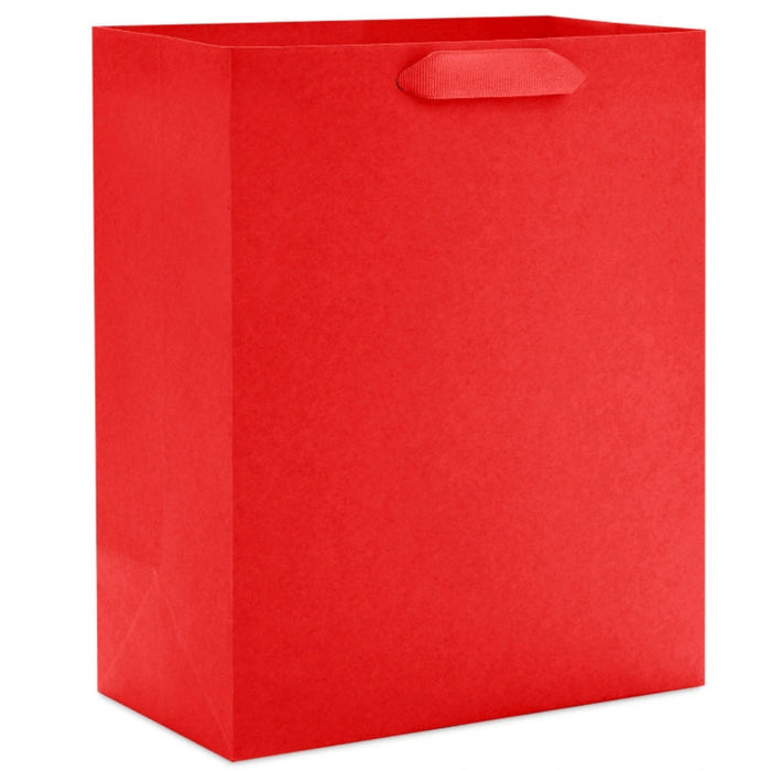 Hallmark 9.6-inch solid red medium gift bag with a classic matte finish, sturdy handles, and a versatile design for birthdays, holidays, and special occasions.