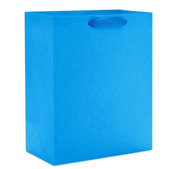 Hallmark 9.6-inch solid royal blue medium gift bag with a vibrant matte finish, sturdy carrying handles, and a classic design for birthdays, holidays, graduations, and special occasions.
