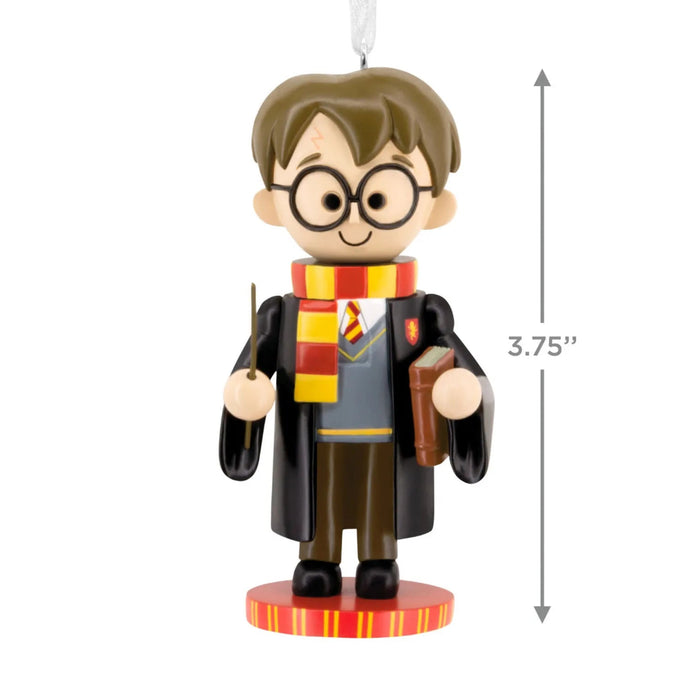 Hallmark Harry Potter™ nutcracker Christmas ornament featuring Harry in Gryffindor robes and scarf, holding his wand, with a hanger attachment.