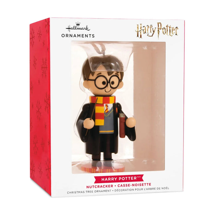 Hallmark Harry Potter™ nutcracker Christmas ornament featuring Harry in Gryffindor robes and scarf, holding his wand, with a hanger attachment.